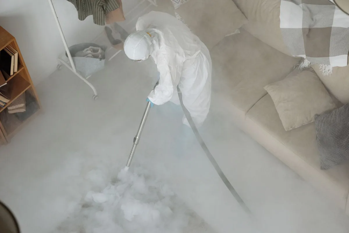 Biohazard cleanup technician in protective equipment, Lodi, CA